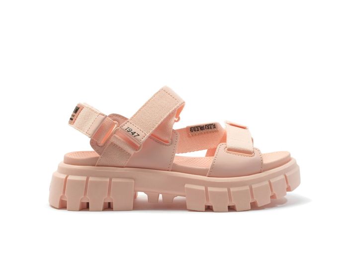 Chunky light salmon-colored platform sandals with Velcro straps and thick lug soles