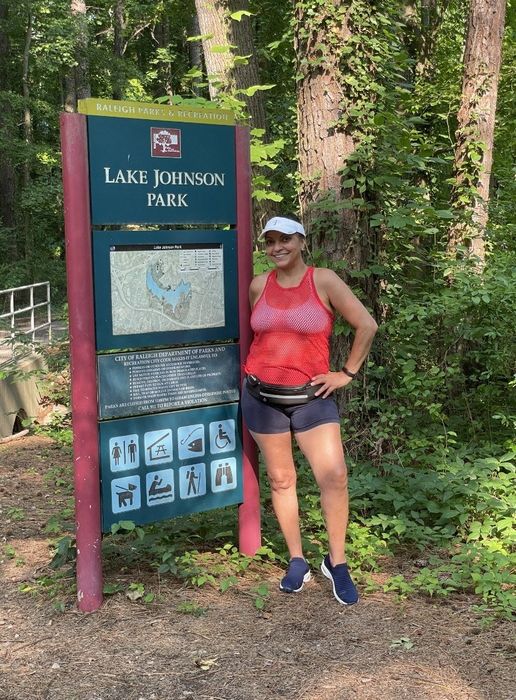 A reviewer wearing navy blue slip-on shoes during a hike
