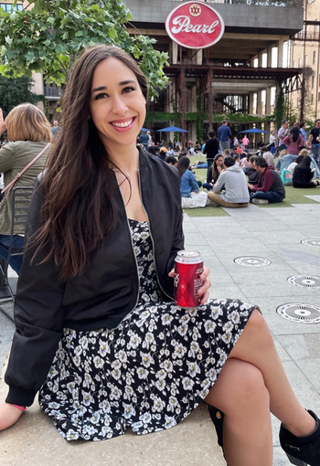 A reviewer wearing a black zip-up jacket.
