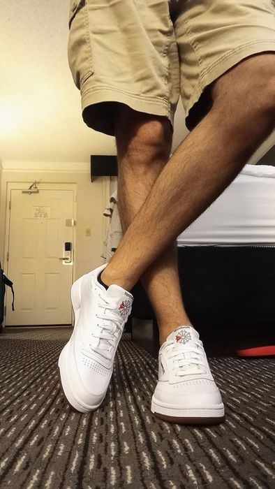 A reviewer wearing the sneakers