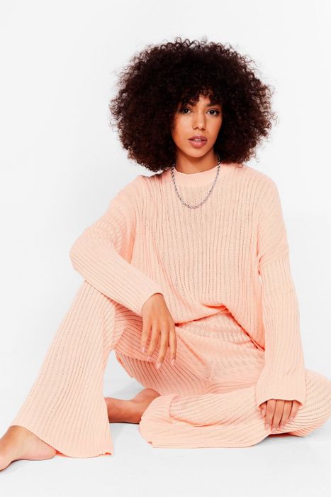 A model showcasing the set in a soft apricot shade