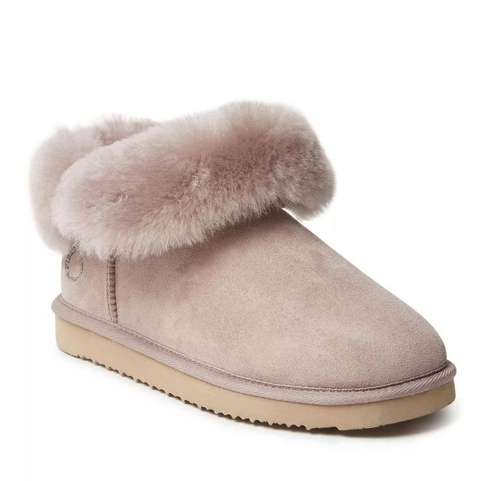 Dusty pink suede boot with fluffy trim on a white background, perfect for winter