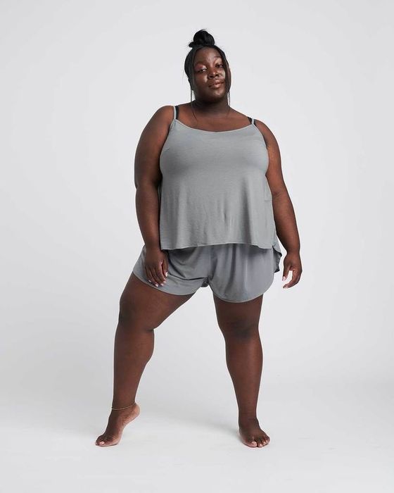 A model flaunting the set in a calming sage color