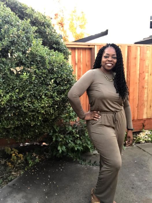 A reviewer styling the jumpsuit in khaki.