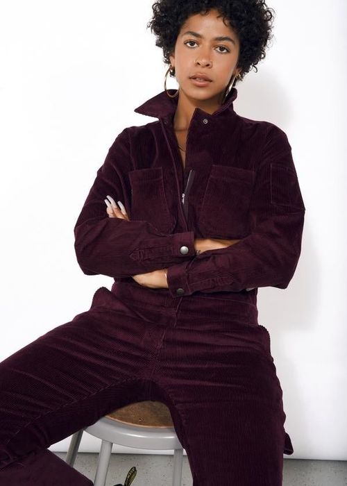 A model rocking the jumpsuit in deep merlot