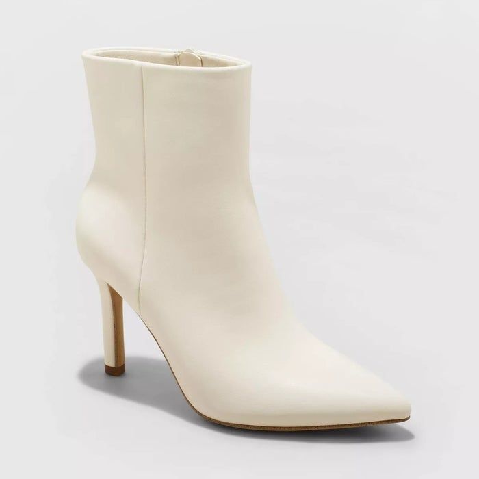 white synthetic leather boots with stiletto heels