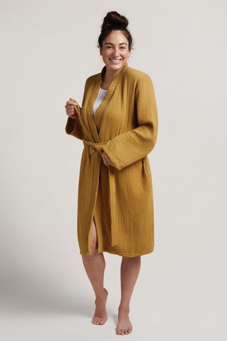 A model showcasing the robe in a rich amber hue.