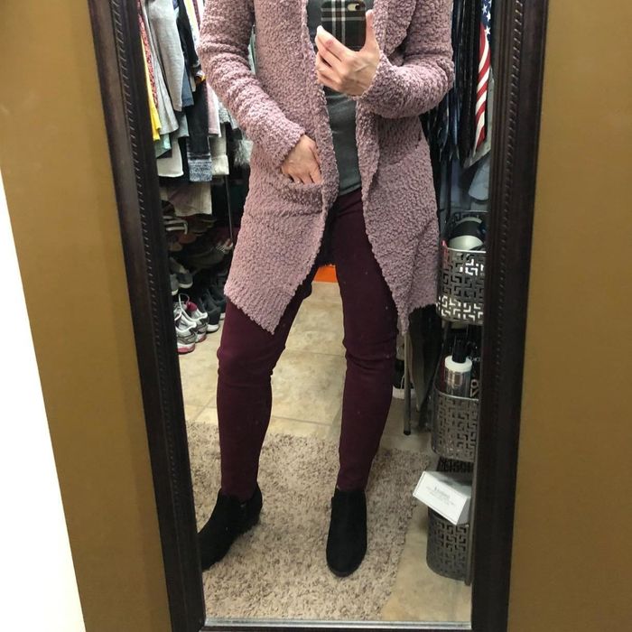 Reviewer wearing a cardigan in the taro shade