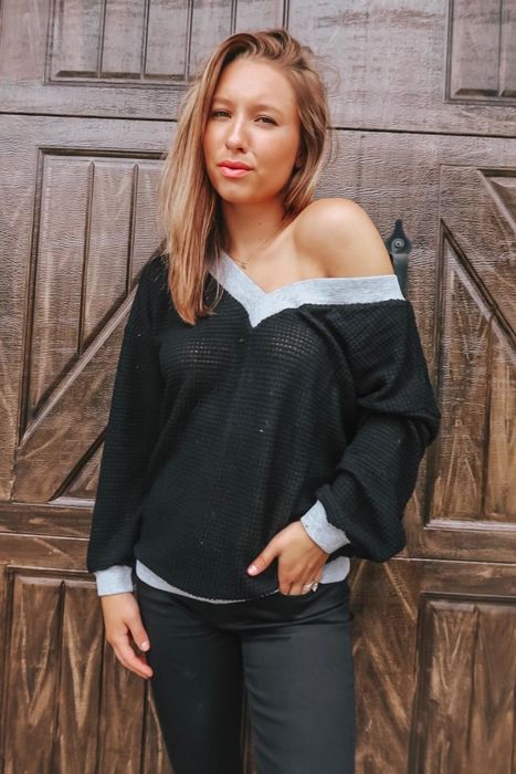 Another reviewer wearing the sweater in classic black.