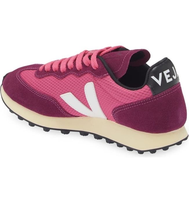 A pink women's shoe featured in the picture.
