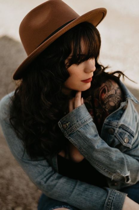 Another reviewer wearing the hat in a rich dark camel shade.
