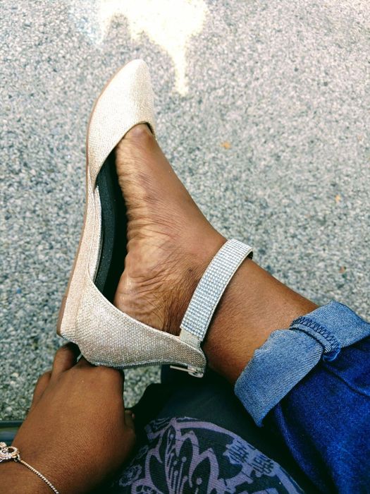 A detailed close-up of the same reviewer's shoe highlighting the low wedge design