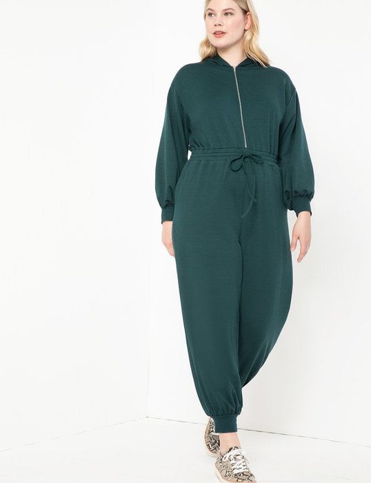 A front view of a model donning the sweatsuit in pine grove.