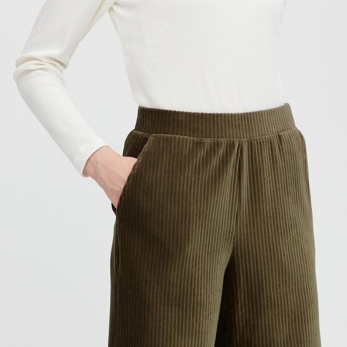 A model sporting the pants in dark green.