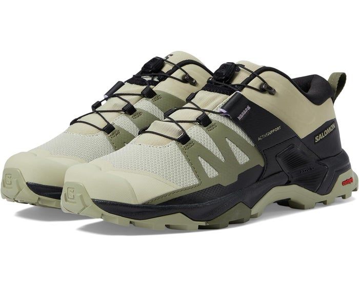 A pair of Salomon hiking shoes with laces, designed for various outdoor activities