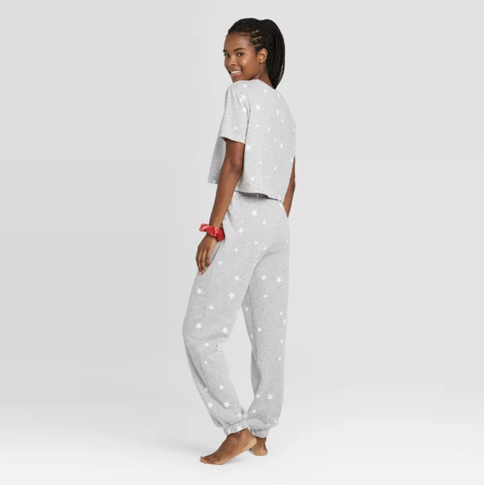 The same model wearing the gray set, captured from the back.
