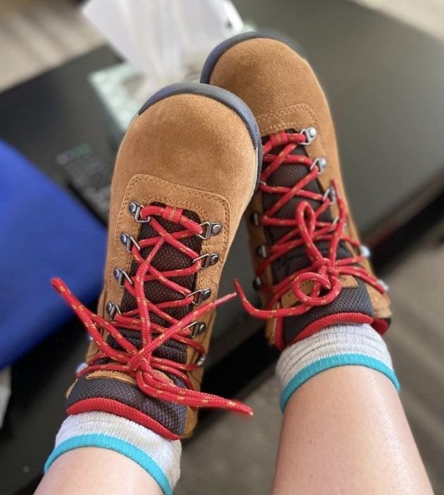 Tan hiking boots featuring red laces