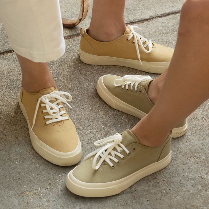 Models showing off the sneakers in teak and sycamore.