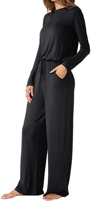 A model showcasing the jumpsuit in black.