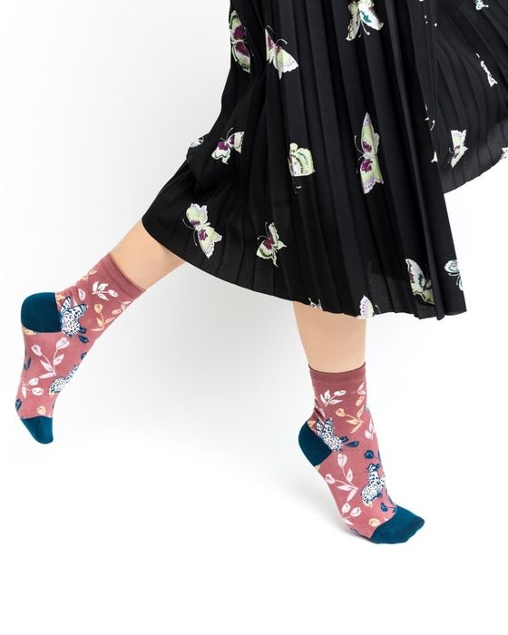 A model sporting the tossed butterfly ankle socks.