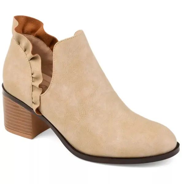 A boot featuring an open slit and a ruffle detail.