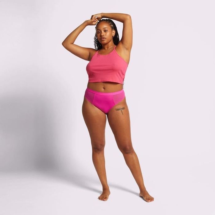A front view of a model showcasing the thong in confetti.