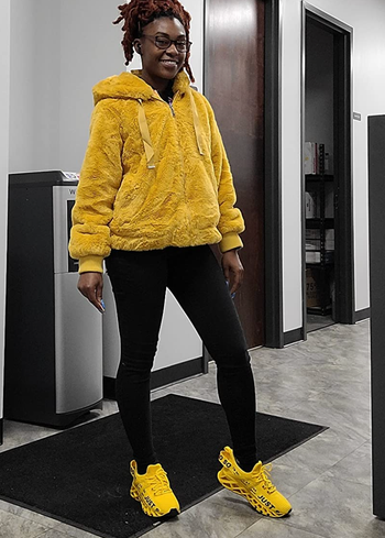 Reviewer showcasing the electric yellow version