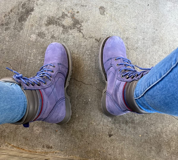 image of a reviewer wearing the marlin-colored boots