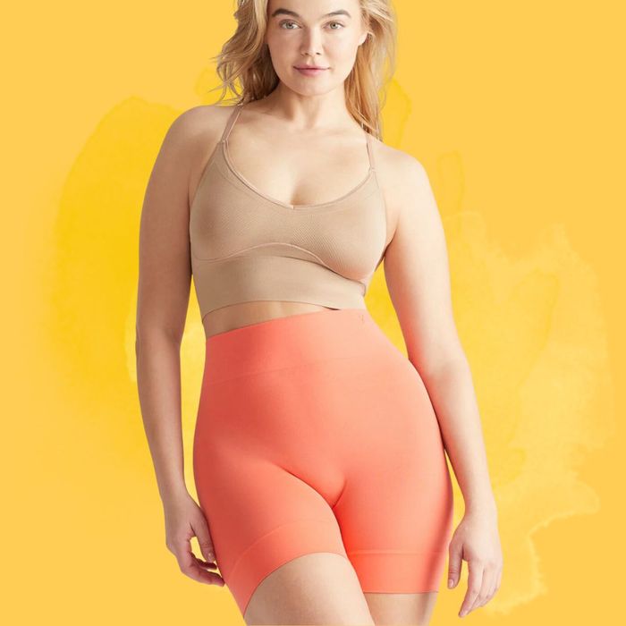A model showcasing the orange shorts