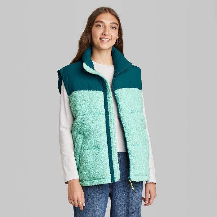model wearing green color block vest