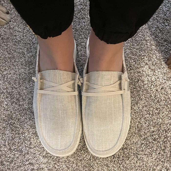 a reviewer showcasing the tan shoes