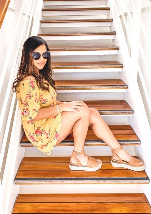 A reviewer is wearing the same sandals, but in a tan shade.