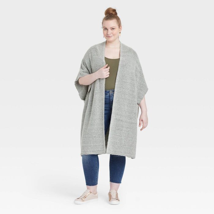 model wearing a long gray knit wrap