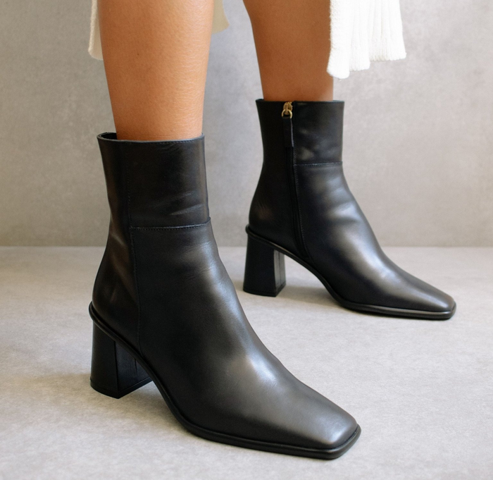 close-up of a model wearing the black ankle boots