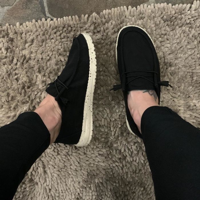a reviewer wearing the black shoes