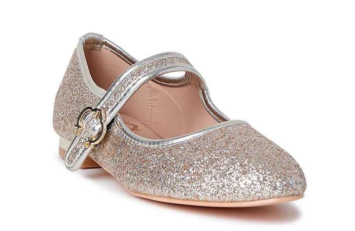 A pair of gold Mary Janes