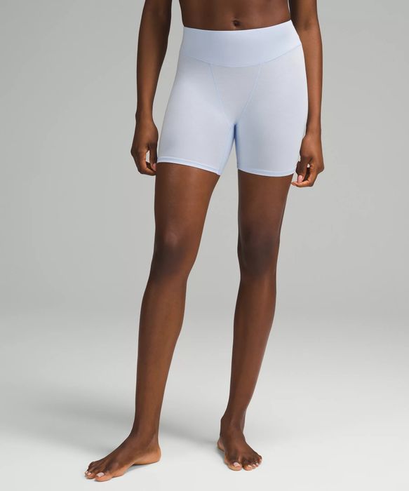 Model wearing the white shorts
