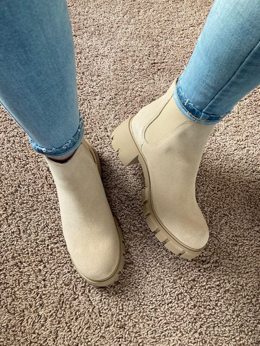 close-up of the sand suede boots on a reviewer's feet