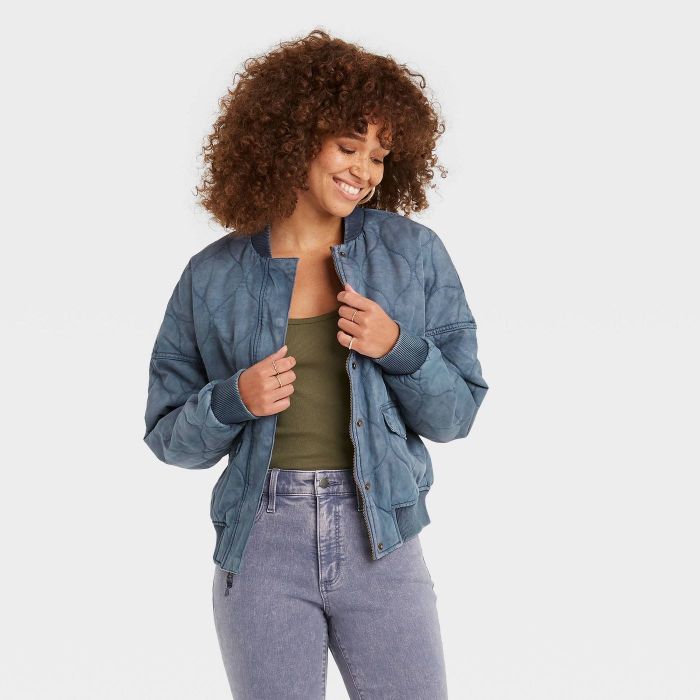 model wearing blue quilted utility jacket