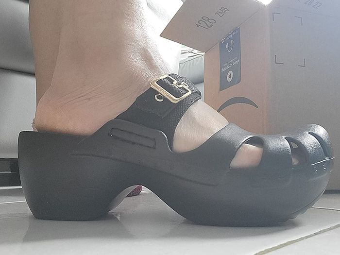 side view of black clogs