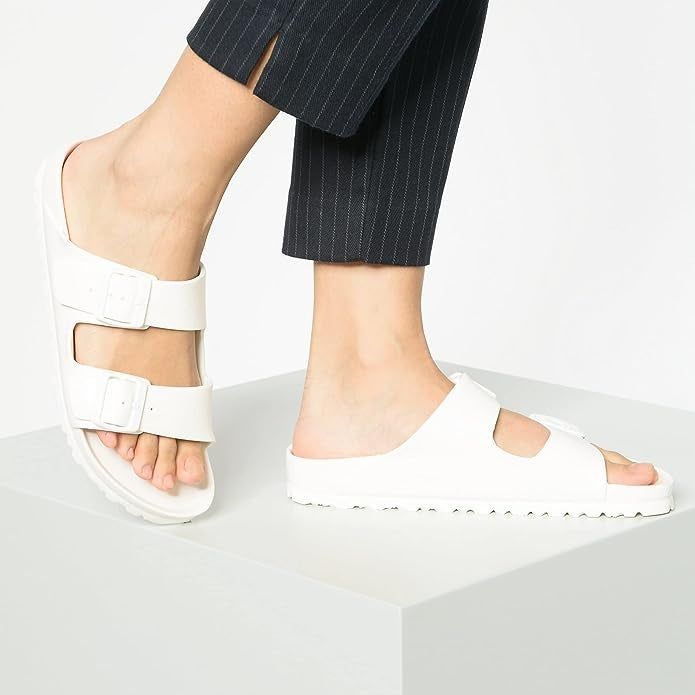 a model showcasing the white rubber slides