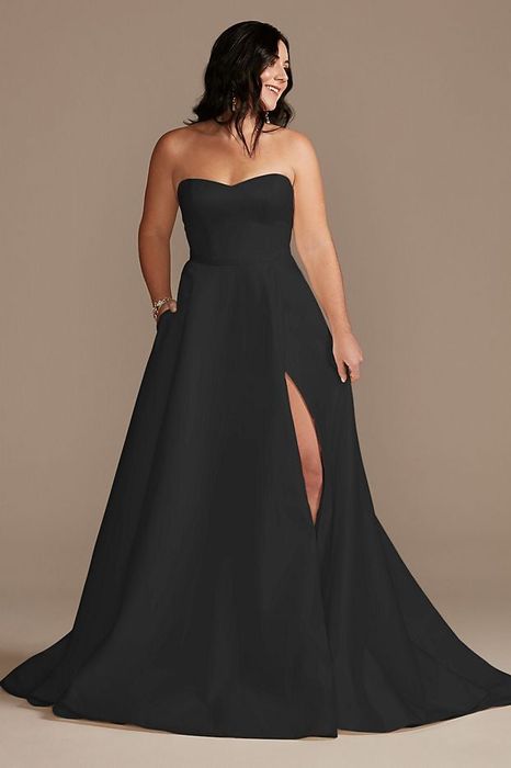 A model showcasing a long black wedding gown