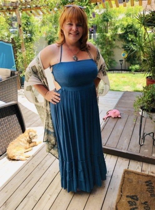 Reviewer wearing the dress in a beautiful blue shade