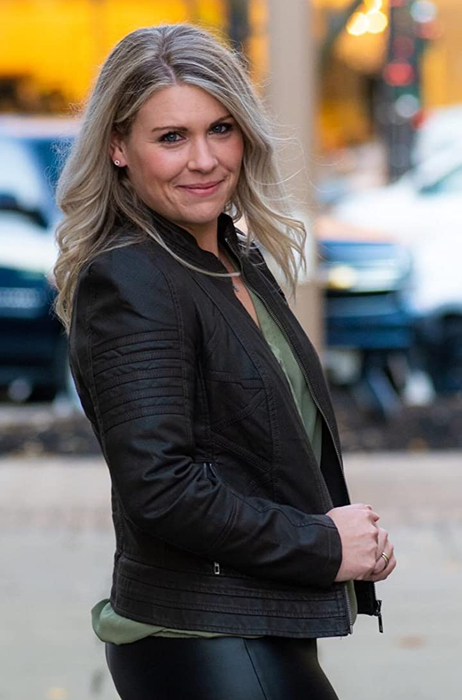 Photo of a reviewer showcasing a black jacket