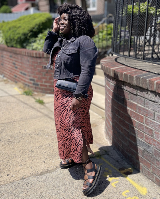 A reviewer showcasing their full outfit, including the sandals