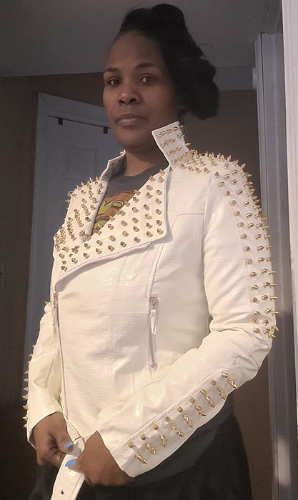 Photo of a reviewer wearing a white jacket
