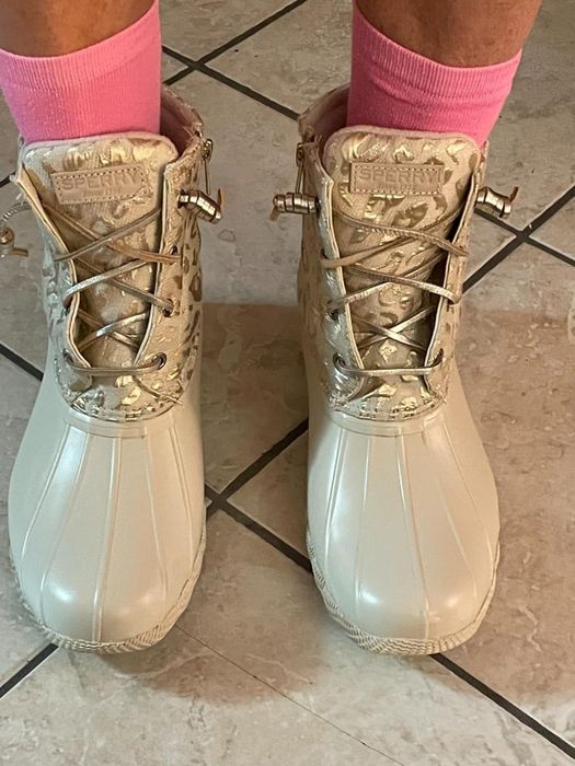 close-up of a reviewer wearing the ivory boots