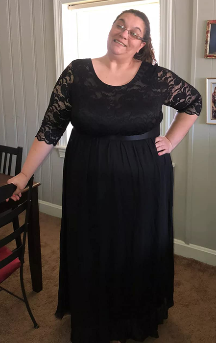 A reviewer in a long black dress