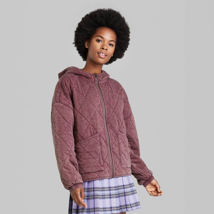 model wearing burgundy hooded quilted jacket