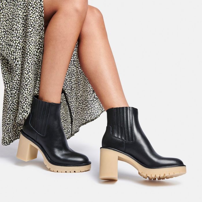 Model wearing heeled black booties